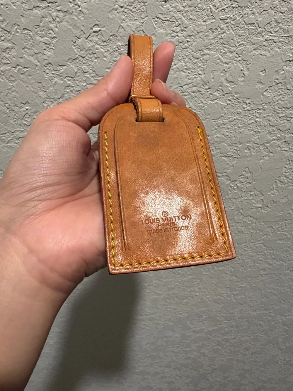 Louis Vuitton leather luggage tag.